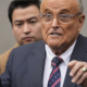 Rudy Giuliani Hawks Rudy Coffee While Dressed as Santa Amid Legal Woes