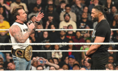 CM Punk Has Heated Confrontation With Roman Reigns Fan at WWE Raw